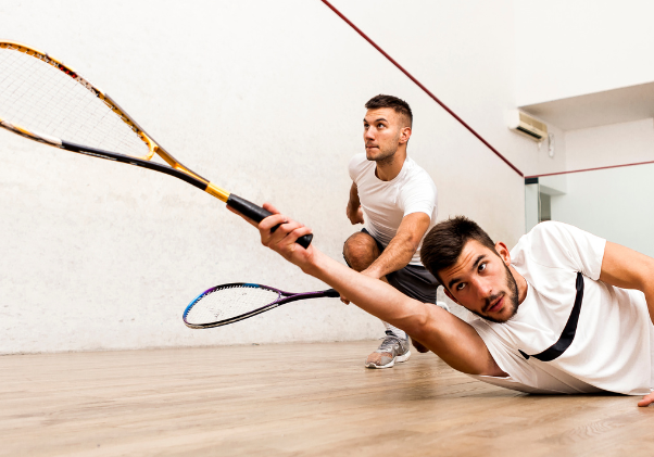 Two men playing squash.