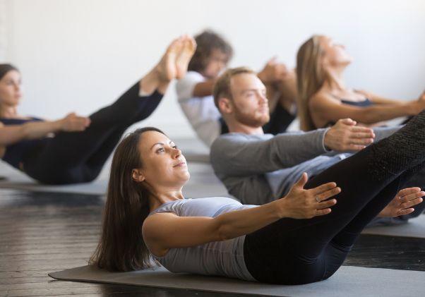 Image of a group of people doing core work in an Integrated Pilates