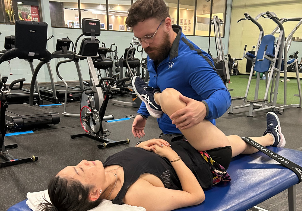 Fascial Stretch Therapist doing a session on a Mayfair Clubs member.