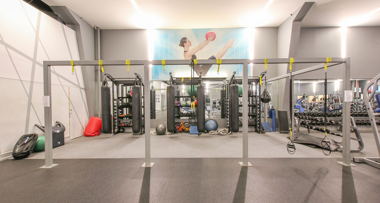 Lakeshore Cardio Area in the gym including Boxing, TRX, and various free weights. Second Angle.