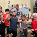 Group of participants in a group exercise class on turf at Mayfair Parkway in Markham.